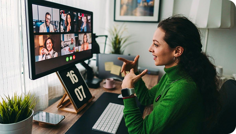 Woman working at desk with video call